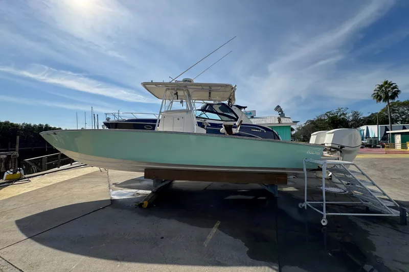 Slide: The Image of 2007 Buddy Davis 31 Custom boat on dry dock under a clear blue sky. - 39
