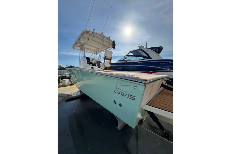 Slide: The Image of 2007 Buddy Davis 31 Custom boat with sleek design under a bright sky. - 40