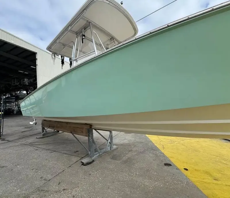 Slide: The Image of 2007 Buddy Davis 31 Custom boat helm with Simrad electronics and wooden deck. - 7