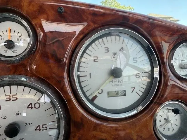 Slide: The Image of Close-up of 2003 Rinker Fiesta Vee 342 dashboard gauges, featuring RPM and speed indicators. - 13