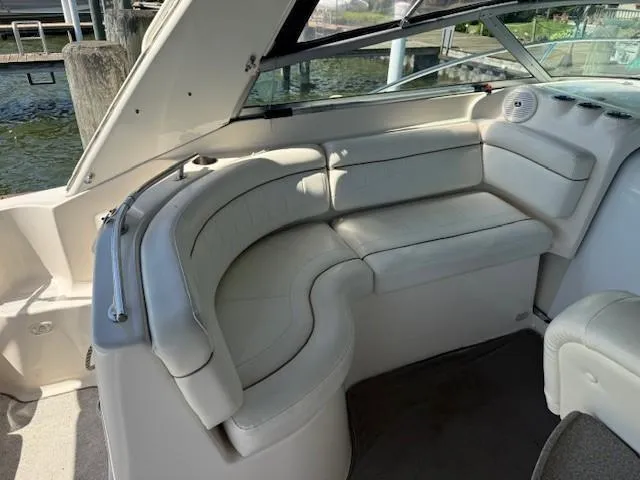 Slide: The Image of 2003 Rinker Fiesta Vee 342 boat interior with white leather seating. - 6
