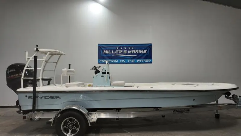 The Image of 2025 Spyder FX19 Vapor boat on trailer at Miller's Marine showroom. - 0