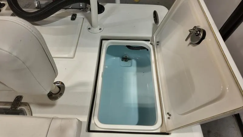 Slide: The Image of 2025 Spyder FX19 Vapor boat with open storage compartment and seating. - 12