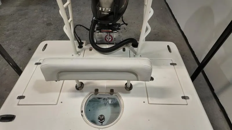 Slide: The Image of 2025 Spyder FX19 Vapor boat deck with Yamaha 115 engine, featuring a livewell and seating. - 14
