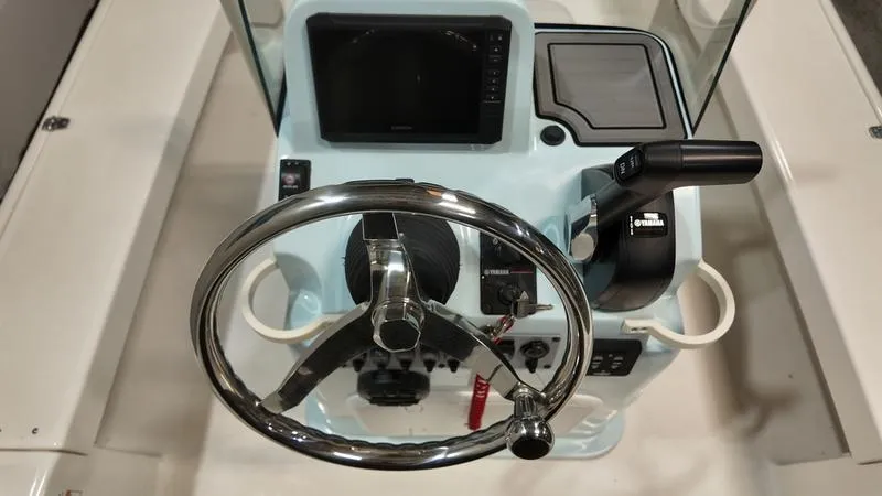 Slide: The Image of 2025 Spyder FX19 Vapor boat console with steering wheel and control panel. - 16
