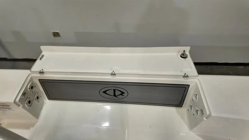 Slide: The Image of 2025 Spyder FX19 Vapor boat interior with storage compartment and sleek design. - 23