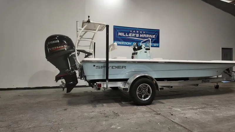 Slide: The Image of 2025 Spyder FX19 Vapor boat on trailer with Yamaha outboard motor at Miller's Marine. - 3