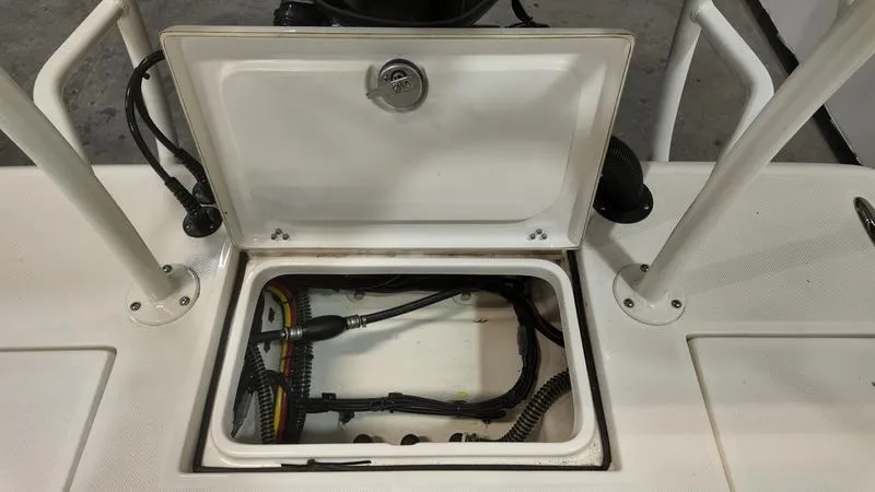 Slide: The Image of Open hatch of 2025 Spyder FX19 Vapor boat showing internal wiring and components. - 8