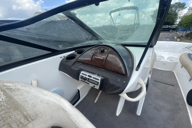 Slide: The Image of 2005 Sea-Doo Utopia 185 dashboard with steering wheel and controls. - 15