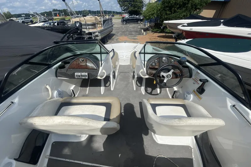 Slide: The Image of 2005 Sea-Doo Utopia 185 boat interior with dual seats and steering console. - 4