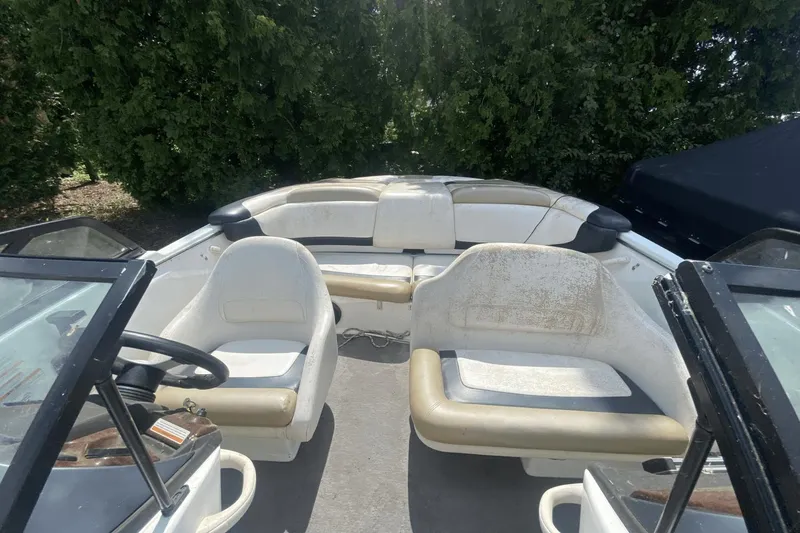 Slide: The Image of 2005 Sea-Doo Utopia 185 boat interior with seating and steering wheel. - 9