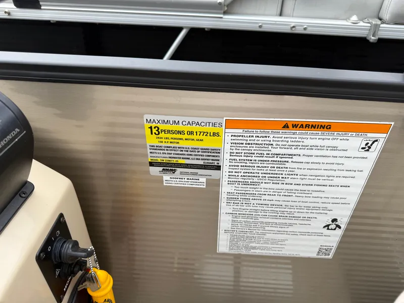 Slide: The Image of Sweetwater 22 boat capacity warning label, 13 persons or 1,772 lbs, 2017 model. - 15