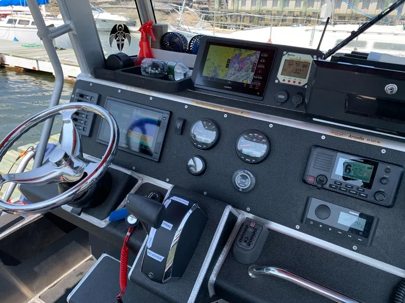 Slide: The Image of 2023 Life Proof 21 Hard Top boat dashboard with navigation and control instruments. - 7