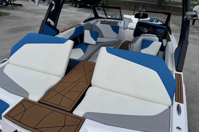 Slide: The Image of 2021 ATX Surf Boats 22 Type-S interior with blue and white seating, modern design. - 10