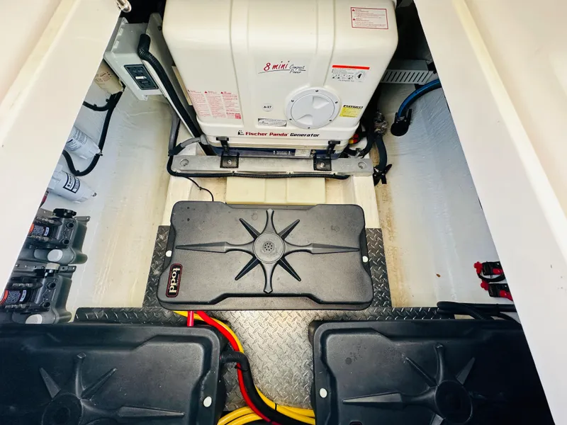 Slide: The Image of Engine compartment of 2023 Back Cove 34O with Fischer Panda generator and wiring. - 35