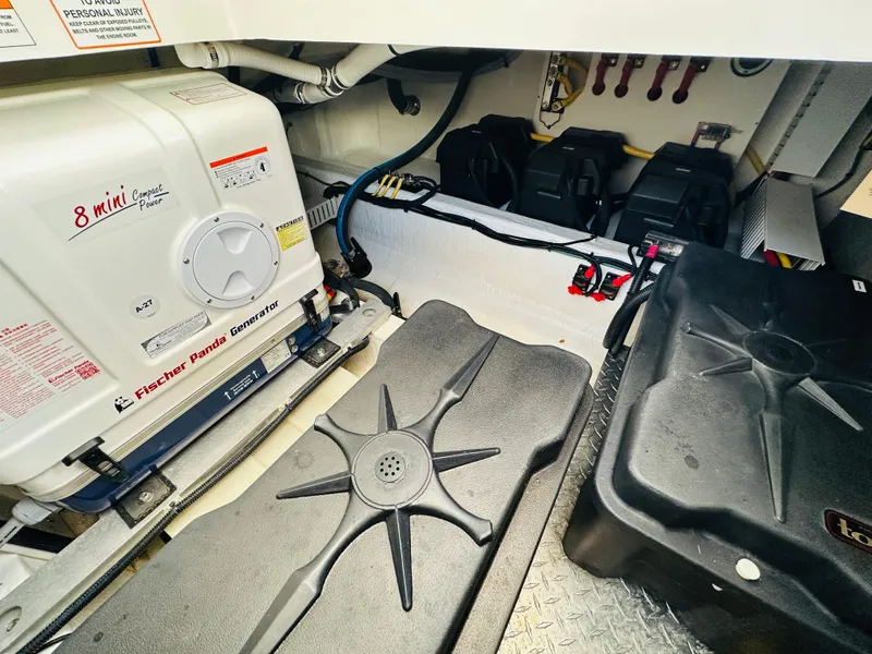 Slide: The Image of Engine room of 2023 Back Cove 34O with Fischer Panda generator and battery setup. - 38