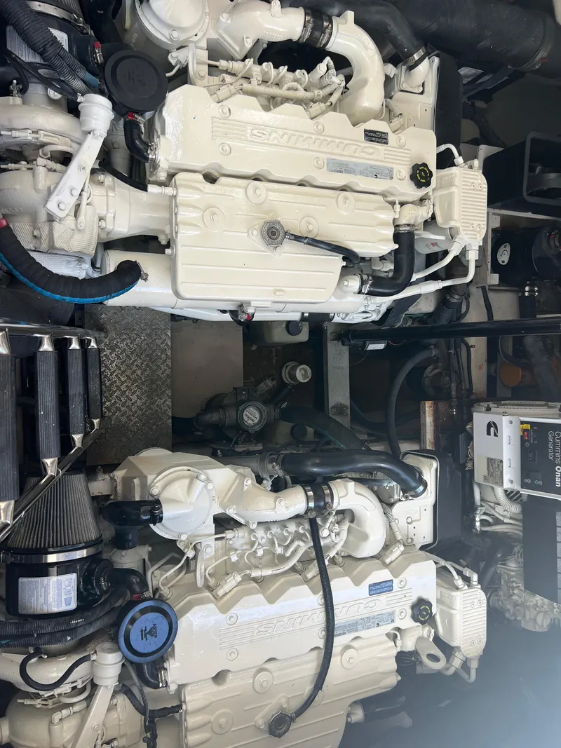 Slide: The Image of Engine room of 2013 Sea Ray 410 Sundancer with twin inboard engines. - 40