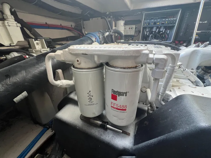 Slide: The Image of Engine compartment of 2013 Sea Ray 410 Sundancer with Fleetguard FF5488 filter. - 48