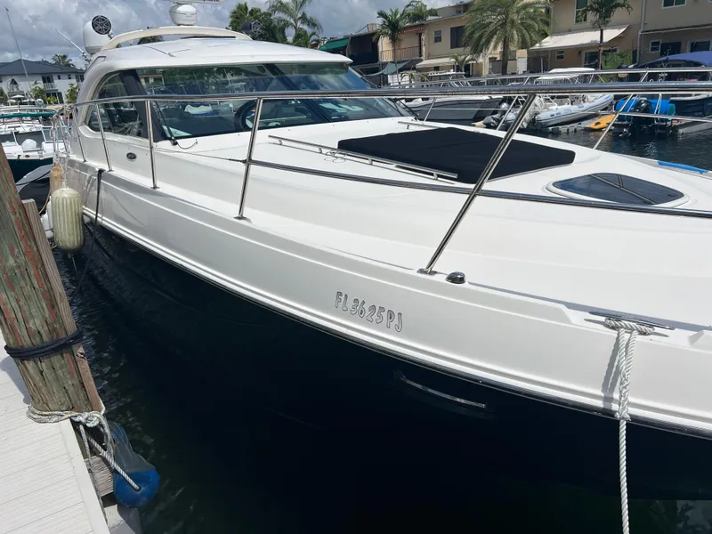 Slide: The Image of 2013 Sea Ray 410 Sundancer yacht docked at marina, sunny day. - 5