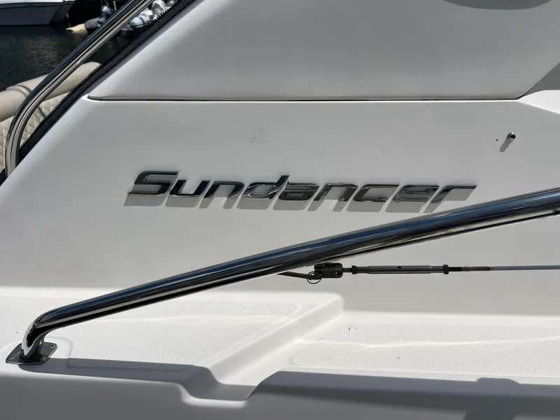 Slide: The Image of Sea Ray 410 Sundancer 2013 boat nameplate with chrome railing detail. - 6