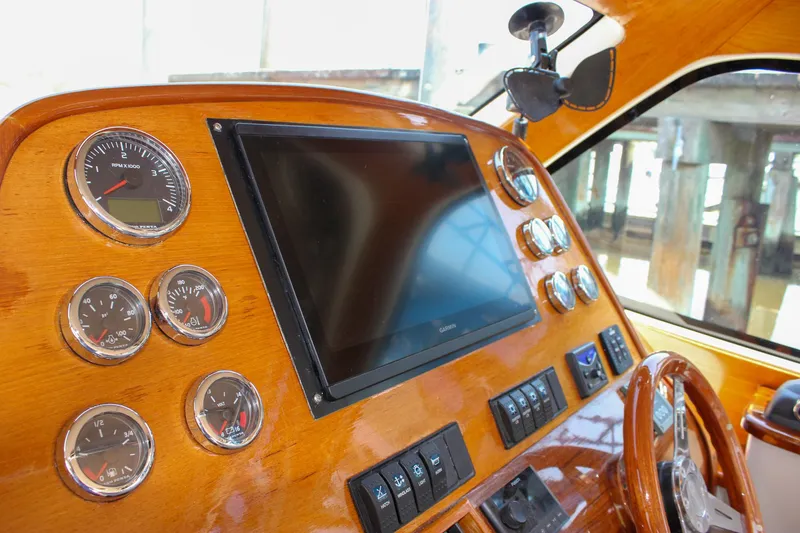 Slide: The Image of Dashboard of 2008 Hinckley Talaria 38R Convertible with gauges and navigation screen. - 15