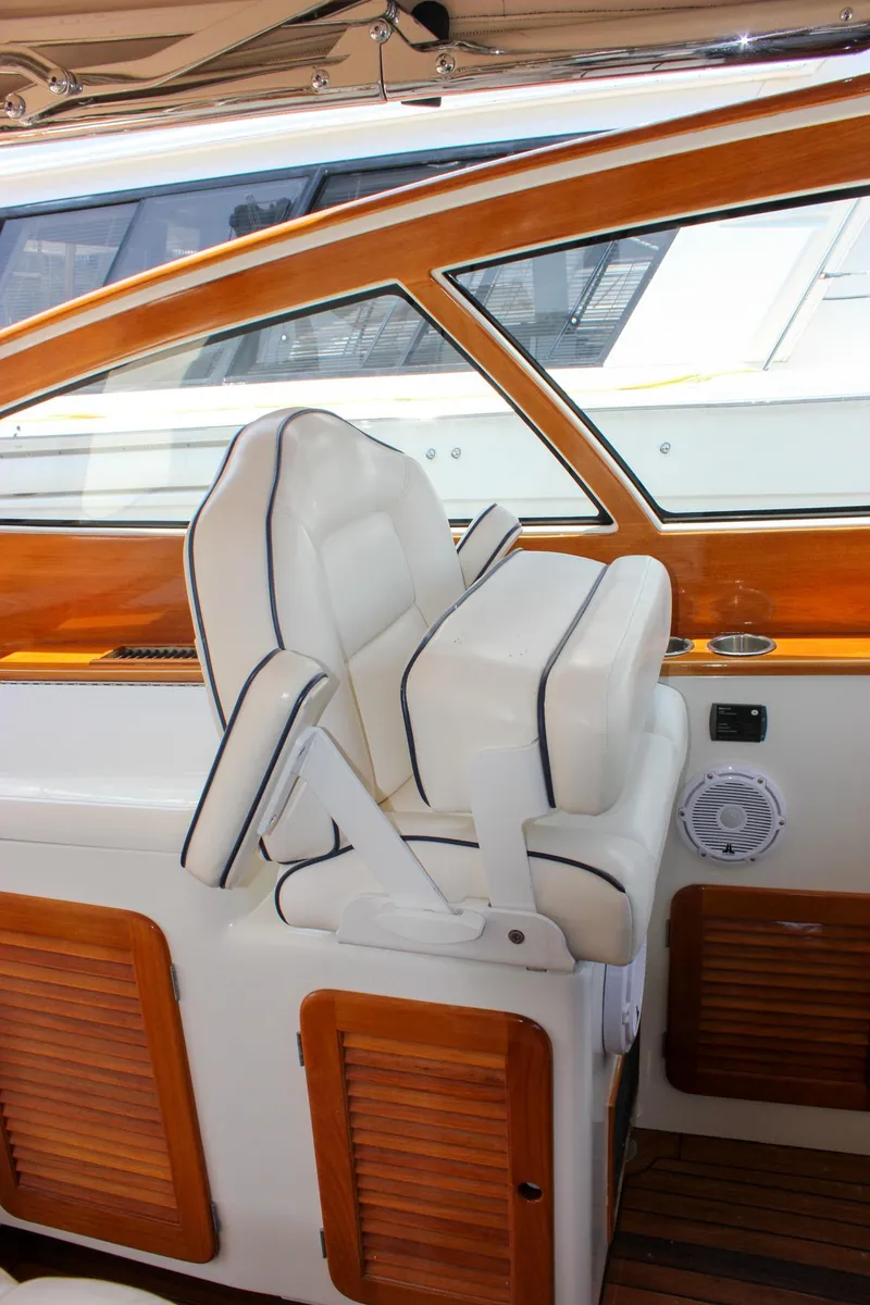 Slide: The Image of Luxury seating on 2008 Hinckley Talaria 38R Convertible yacht with wood accents. - 21