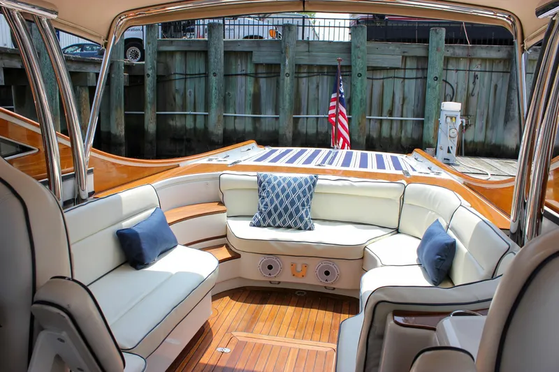 Slide: The Image of Luxurious seating area on a 2008 Hinckley Talaria 38R Convertible yacht with elegant cushions. - 22
