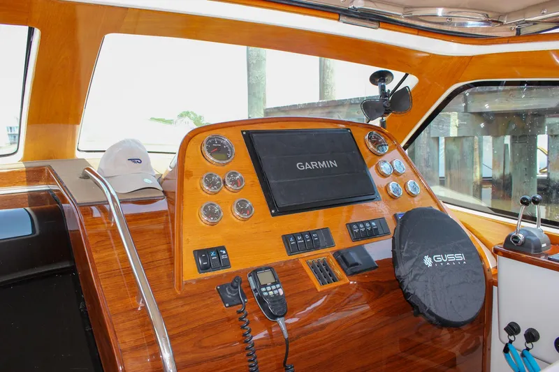 Slide: The Image of 2008 Hinckley Talaria 38R Convertible helm with Garmin navigation and Gussi Italia steering wheel. - 25