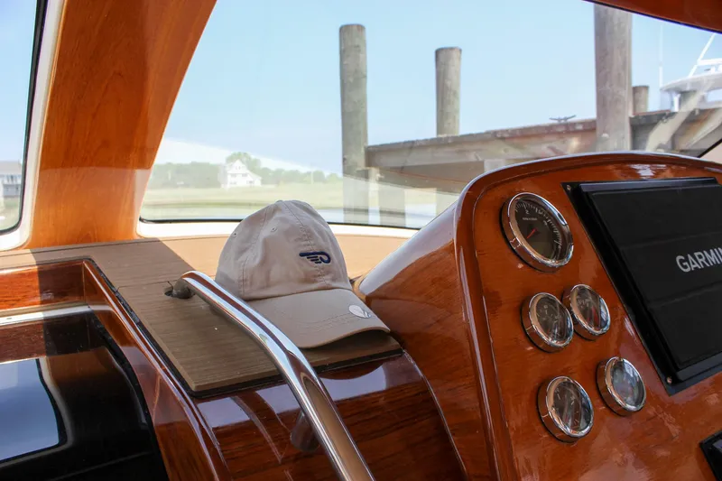 Slide: The Image of Interior of 2008 Hinckley Talaria 38R Convertible with wooden dashboard and gauges. - 26