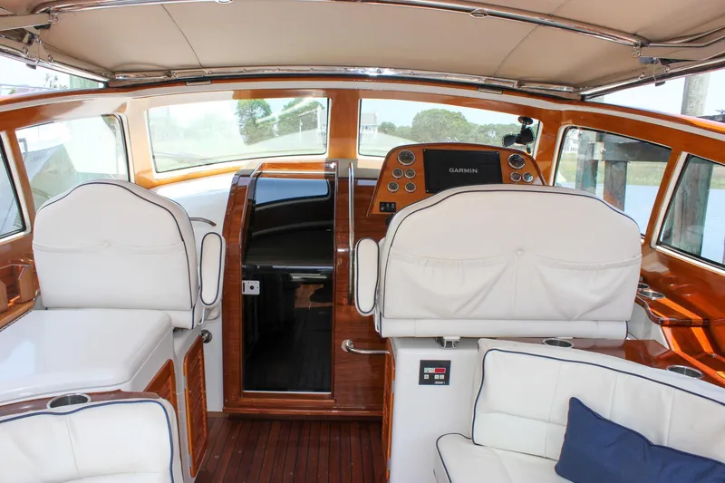 Slide: The Image of Interior of 2008 Hinckley Talaria 38R Convertible yacht with elegant seating and navigation equipment. - 6