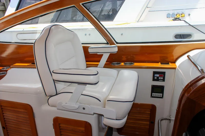 Slide: The Image of Luxurious white captain's chair on 2008 Hinckley Talaria 38R Convertible yacht. - 20