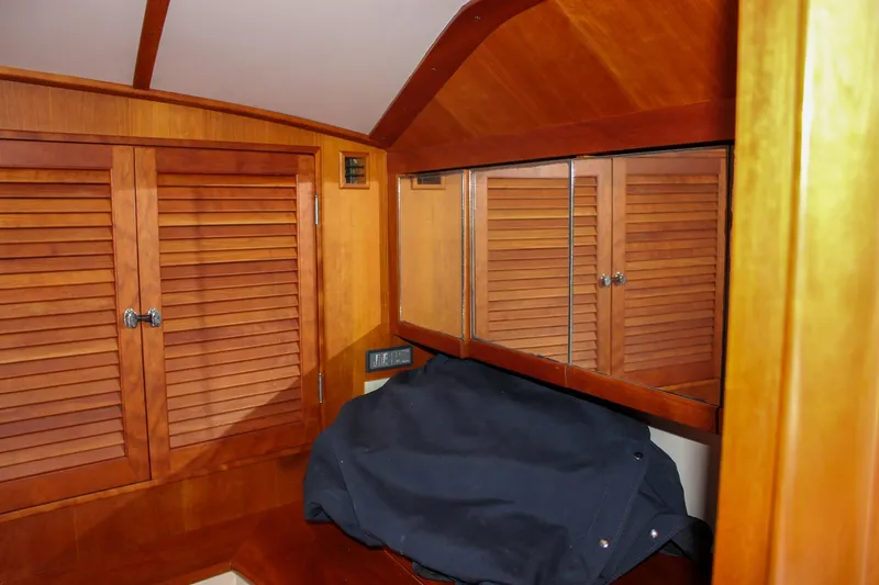 Slide: The Image of Interior of 2008 Hinckley Talaria 38R Convertible with wooden cabinetry and mirrored surfaces. - 37