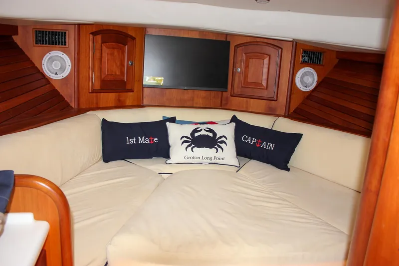 Slide: The Image of Luxurious interior of 2008 Hinckley Talaria 38R Convertible with nautical-themed cushions. - 39