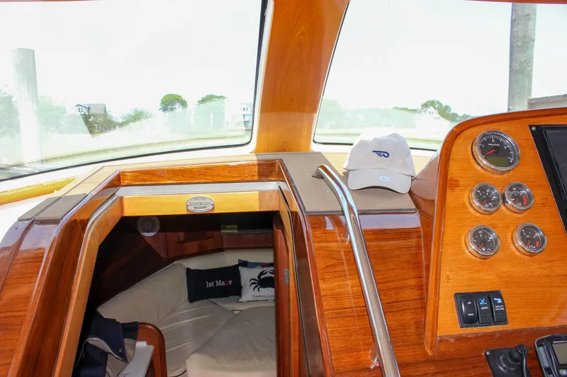 Slide: The Image of Interior of 2008 Hinckley Talaria 38R Convertible with wooden dashboard and gauges. - 42