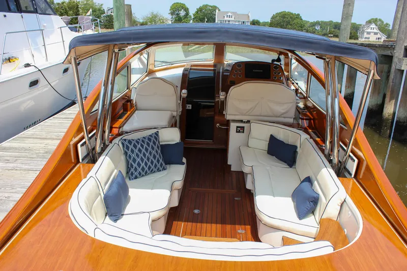 Slide: The Image of 2008 Hinckley Talaria 38R Convertible yacht with elegant seating and wooden deck. - 43