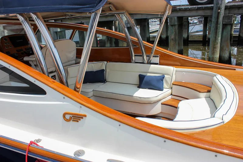 Slide: The Image of 2008 Hinckley Talaria 38R Convertible yacht with elegant seating and polished wood accents. - 47