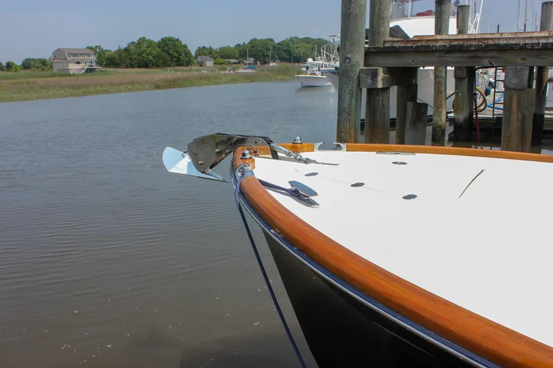 Slide: The Image of 2008 Hinckley Talaria 38R Convertible docked by a serene waterfront. - 49