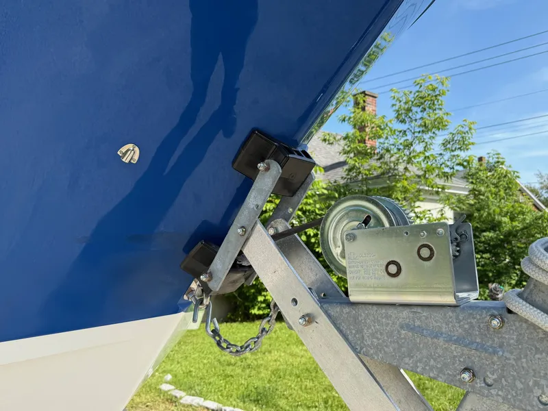 Slide: The Image of 2008 Pro-Line 29 Grand Sport boat on trailer, close-up of bow and winch mechanism. - 11