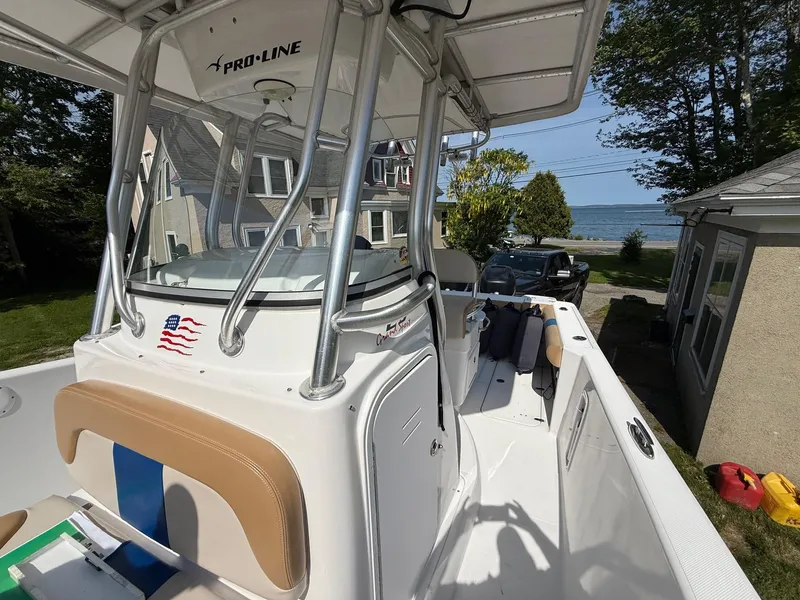 Slide: The Image of 2008 Pro-Line 29 Grand Sport boat with coastal view in background. - 17