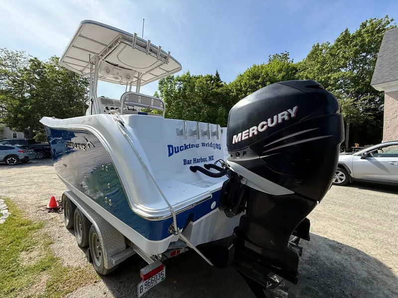 Slide: The Image of 2008 Pro-Line 29 Grand Sport boat with Mercury engine, parked on a trailer in Bar Harbor. - 5