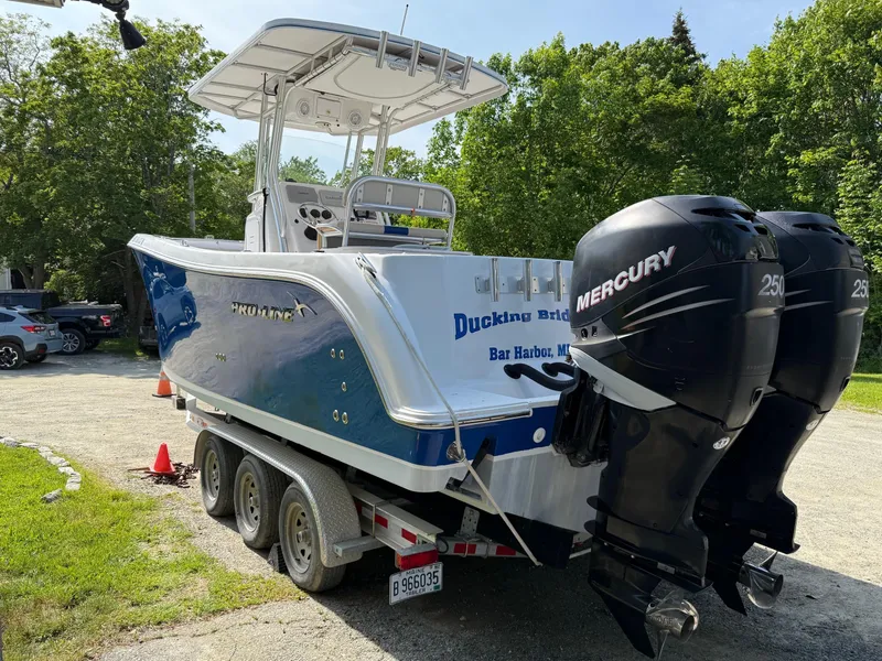 Slide: The Image of 2008 Pro-Line 29 Grand Sport boat with dual Mercury engines on a trailer. - 6