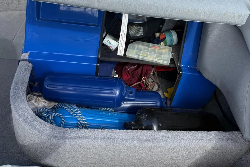 Slide: The Image of Storage compartment in a 2008 Supra Launch 22 SSV boat with equipment and accessories. - 10
