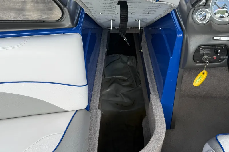 Slide: The Image of 2008 Supra Launch 22 SSV interior storage compartment and dashboard controls. - 15