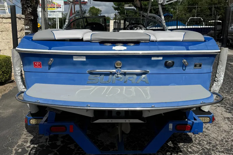 Slide: The Image of 2008 Supra Launch 22 SSV boat, blue exterior, rear view on trailer. - 6