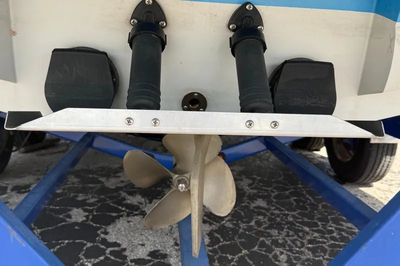 Slide: The Image of 2008 Supra Launch 22 SSV boat propeller and rudder detail on trailer. - 7
