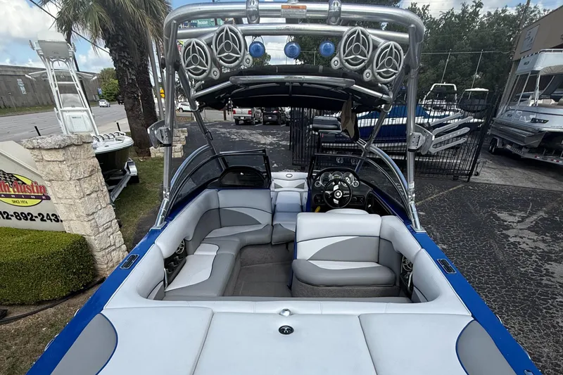 Slide: The Image of 2008 Supra Launch 22 SSV interior with seating and sound system, parked outdoors. - 8