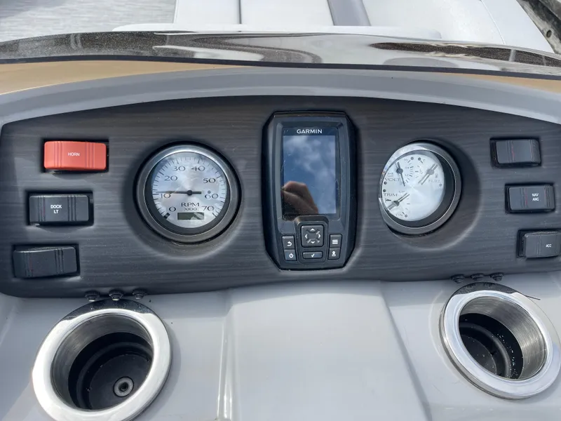 Slide: The Image of Dashboard of 2022 Bennington 21 SX boat with gauges and Garmin display. - 13