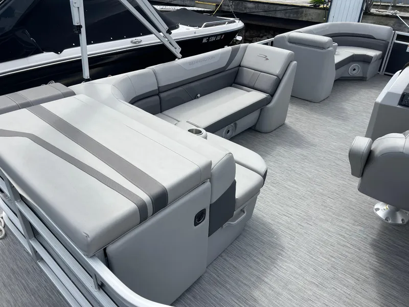 Slide: The Image of 2022 Bennington 21 SX pontoon boat interior with gray seating and modern design. - 18