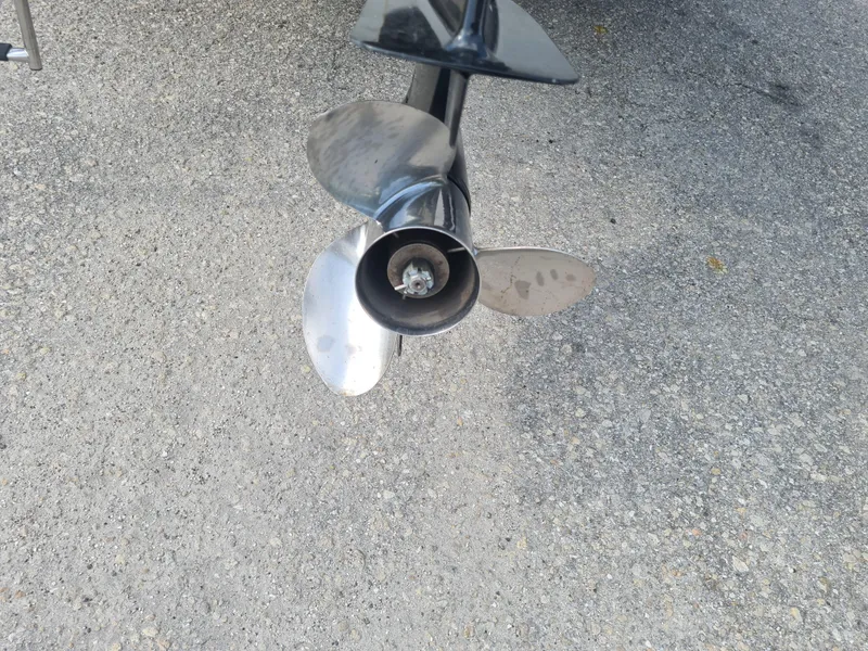 Slide: The Image of Propeller of 2000 Key West 2300 WA Bluewater boat on pavement. - 22