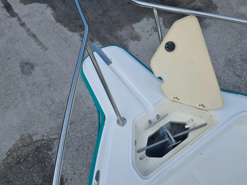 Slide: The Image of Bow of 2000 Key West 2300 WA Bluewater boat with anchor compartment open. - 6